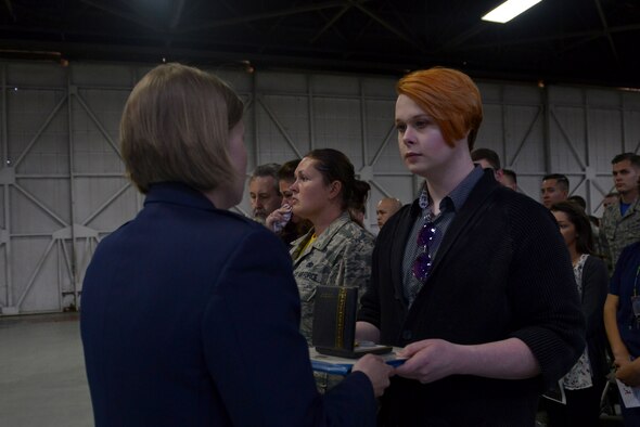 U.S. Air Force Maj. Kristen M. Torma, 20th Aircraft Maintenance Squadron (AMXS) commander, presents the Air Force Commendation Medal to Dallas G. Sanford, spouse of the late Staff Sgt. Austin Terrell, 20th AMXS armament technician, during his memorial service at Shaw Air Force Base, S.C., April 7, 2017. Terrell was posthumously awarded the Air Force Commendation Medal and promoted to the rank of staff sergeant. (U.S. Air Force photo by Airman 1st Class Destinee Sweeney)