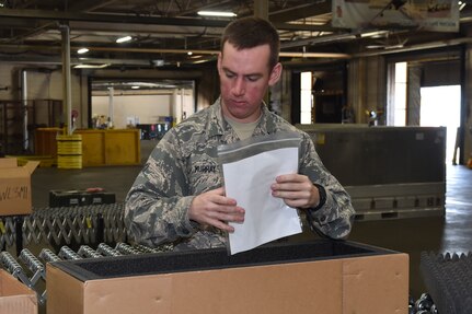 Airman 1st Class William Murray, 437th Aerial Port Squadron inbound cargo technician, checks cargo for proper documentation March 29, 2017, at Joint Base Charleston, South Carolina. The Transportation Management Office is responsible for processing inbound cargo for base mission partners and sending outbound cargo all over the world.