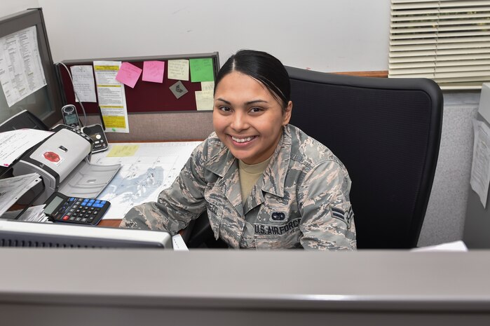 Airman 1st Class Kaitlyn Escobedo, 437 Aerial Port Squadron personal property technician, works at her computer March 29, 2017, at Joint Base Charleston, South Carolina. The Transportation Management Office personal property section is responsible for scheduling household goods moves for service members who are having permanent change of station, TDY or deployments. They also handle travel arrangements for service members with orders.