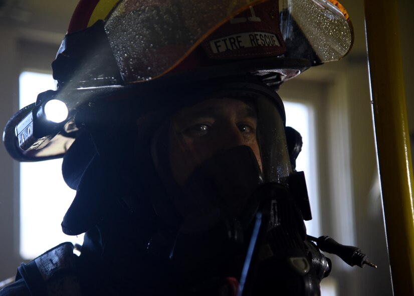 Brad Voorhees, 22nd Civil Engineer Squadron lead firefighter, pauses during a training exercise April 6, 2017, in base housing at McConnell Air Force Base, Kan. The training was performed several times in order to provide as much experience to the firefighters as possible. (U.S. Air Force photo/Airman 1st Class Erin McClellan)