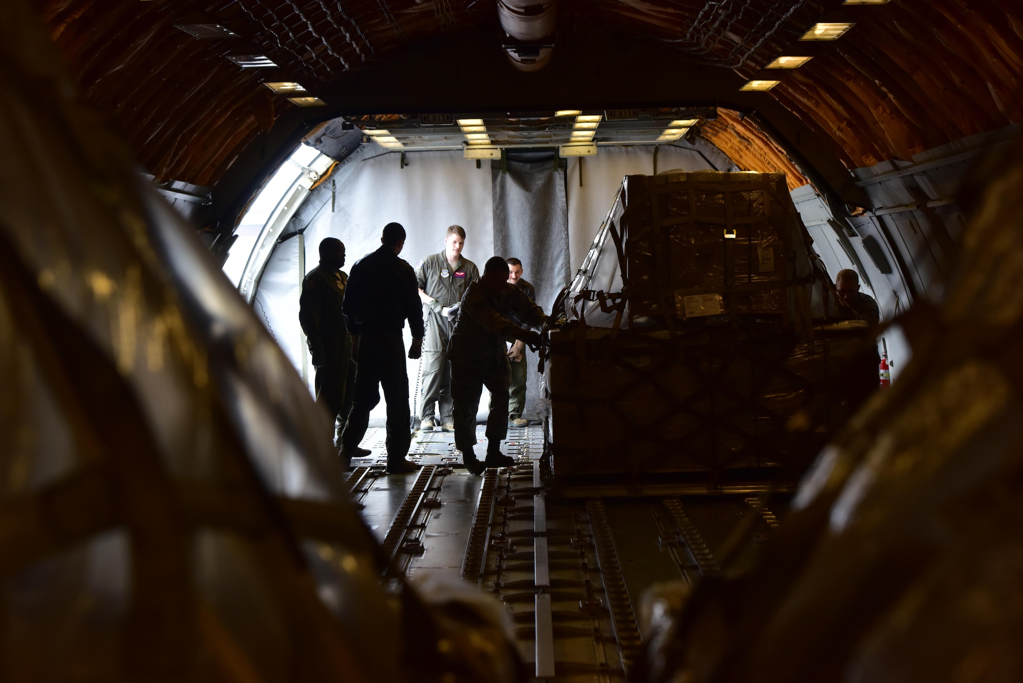 Airmen with the 509th and 131st Logistics Readiness Squadrons load a KC-10 Extender aircraft with 70 pallets of food in support of Convoy of Hope at Whiteman Air Force Base, Mo., April 1, 2017. More than 84,000 pounds of fortified rice and soy protein were convoyed in an initiative to feed more than 65,000 children in Haiti. (U.S. Air Force photo by Senior Airman Jovan Banks)