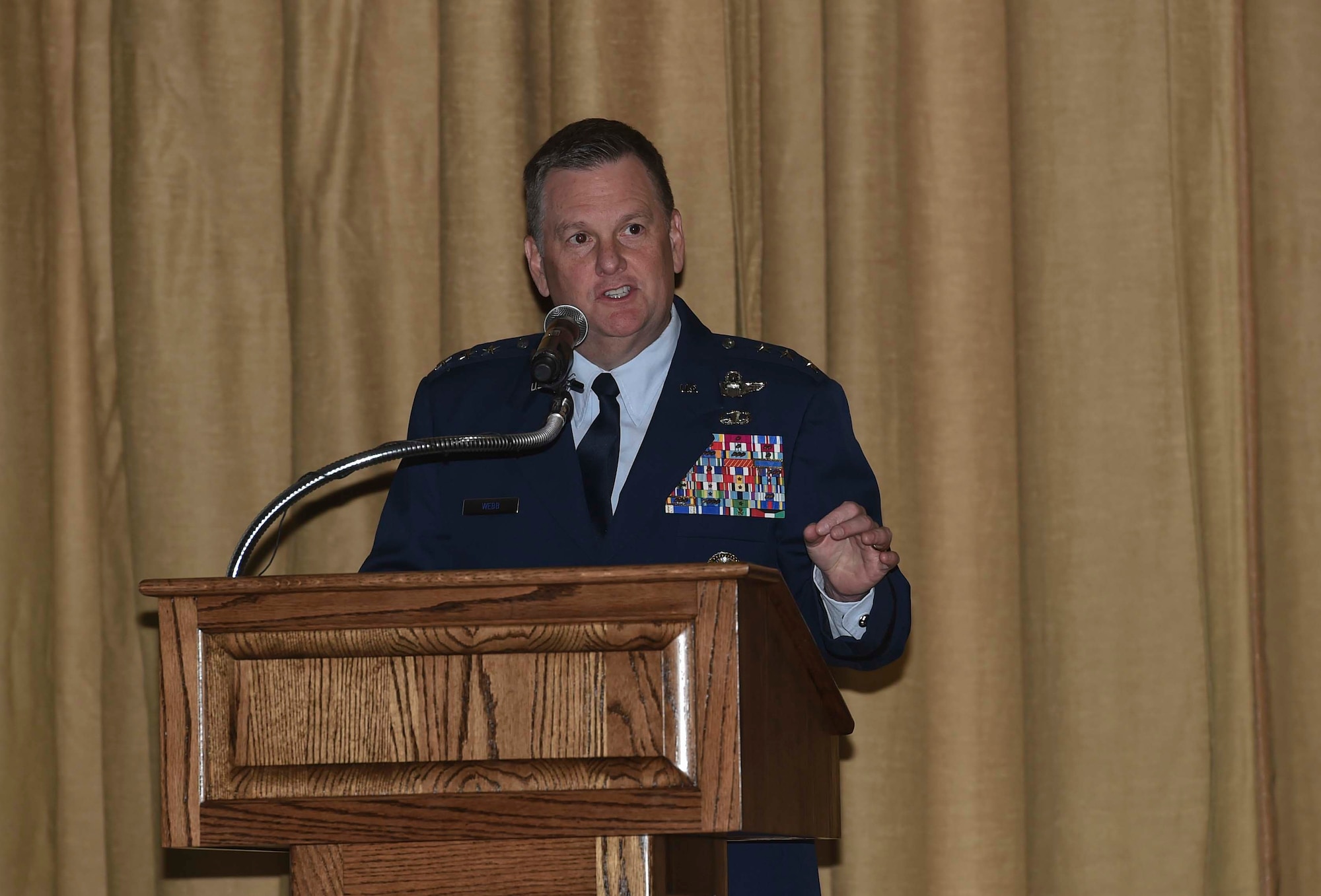 Lt. Gen. Brad Webb, commander of Air Force Special Operations Command, speaks during a Silver Star Medal presentation ceremony for Tech. Sgt. Brian Claughsey, a combat controller with the 21st Special Tactics Squadron, April 7, 2017, at Pope Army Airfield, N.C. Claughsey received the Silver Star Medal for his role in liberating Kunduz City from Taliban control and ensuring the safety of a 150 joint-coalition team during a 96-hour firefight. (U.S. Air Force photo by Senior Airman Ryan Conroy)