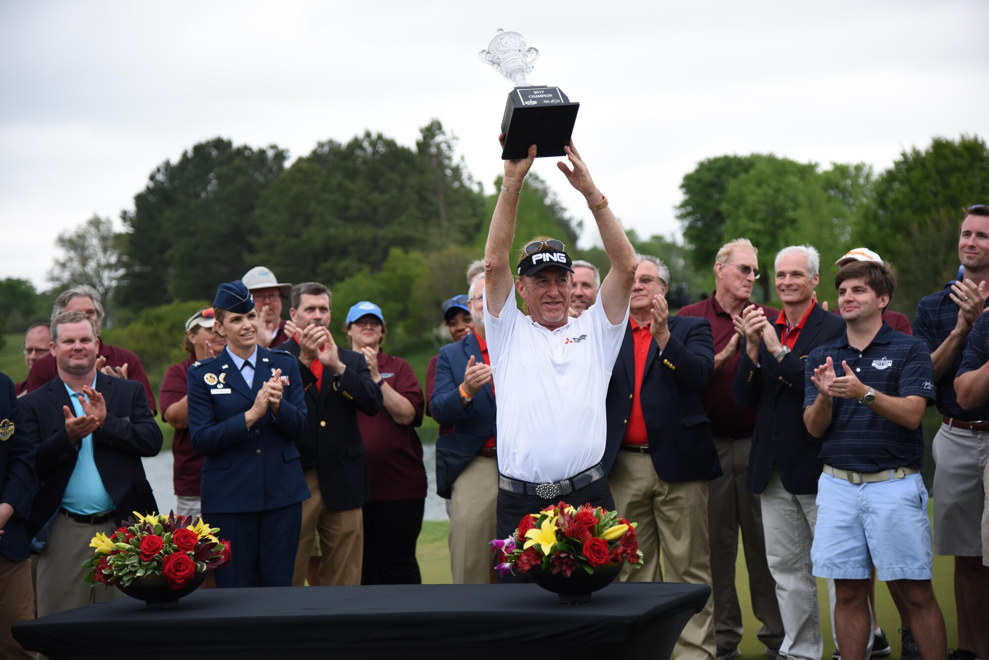 Miguel Jimenez, Professional Golfers’ Association golfer, displays his trophy after winning the Mississippi Gulf Resort Classic at the Fallen Oak Golf Course, April 2, 2017, in Saucier, Miss. Col. Michele Edmondson, 81st Training Wing commander, and Keesler personnel participated in the festivities. (U.S. Air Force photo by Kemberly Groue)