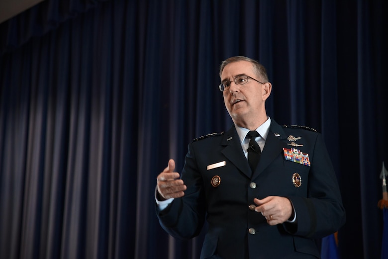 PETERSON AIR FORCE BASE, Colo. – Gen. John Hyten, U.S. Strategic Command commander, congratulates the 21st Space Wing for winning the Omaha Trophy at a ceremony in the auditorium on Peterson Air Force Base, Colo., April 6, 2017. The wing was recognized as USSTRATCOM’s premier unit for global operations. (U.S. Air Force photo by Airman 1st Class Dennis Hoffman) 