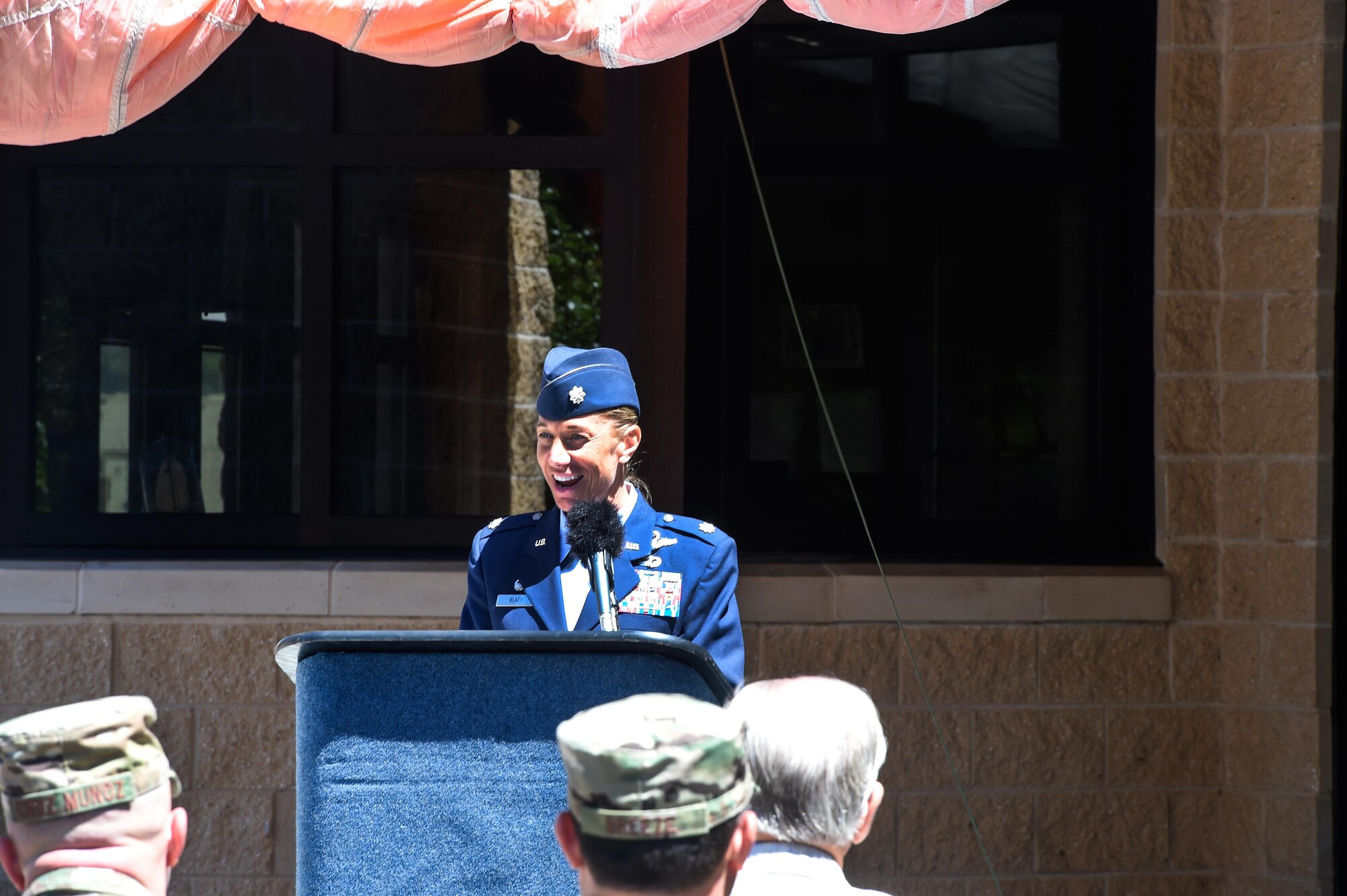 Lt. Col. Allison Black, the commander of the 319th Special Operations Squadron, delivers remarks on retired Lt. Col. Richard E. Cole, the last surviving Doolittle Raider, during the 319th SOS building renaming and dedication ceremony at Hurlburt Field, Fla., April 7, 2017. The building was renamed after Cole, who retired from active duty with a list of accomplishments and awards that includes: the Distinguished Flying Cross with two oak leaf clusters, the Bronze Star medal, the Air Force Commendation medal, the Chinese Army, Navy, Air Corps medal, Class A, 1st Grade. (U.S. Air Force photo by Senior Airman Jeff Parkinson)