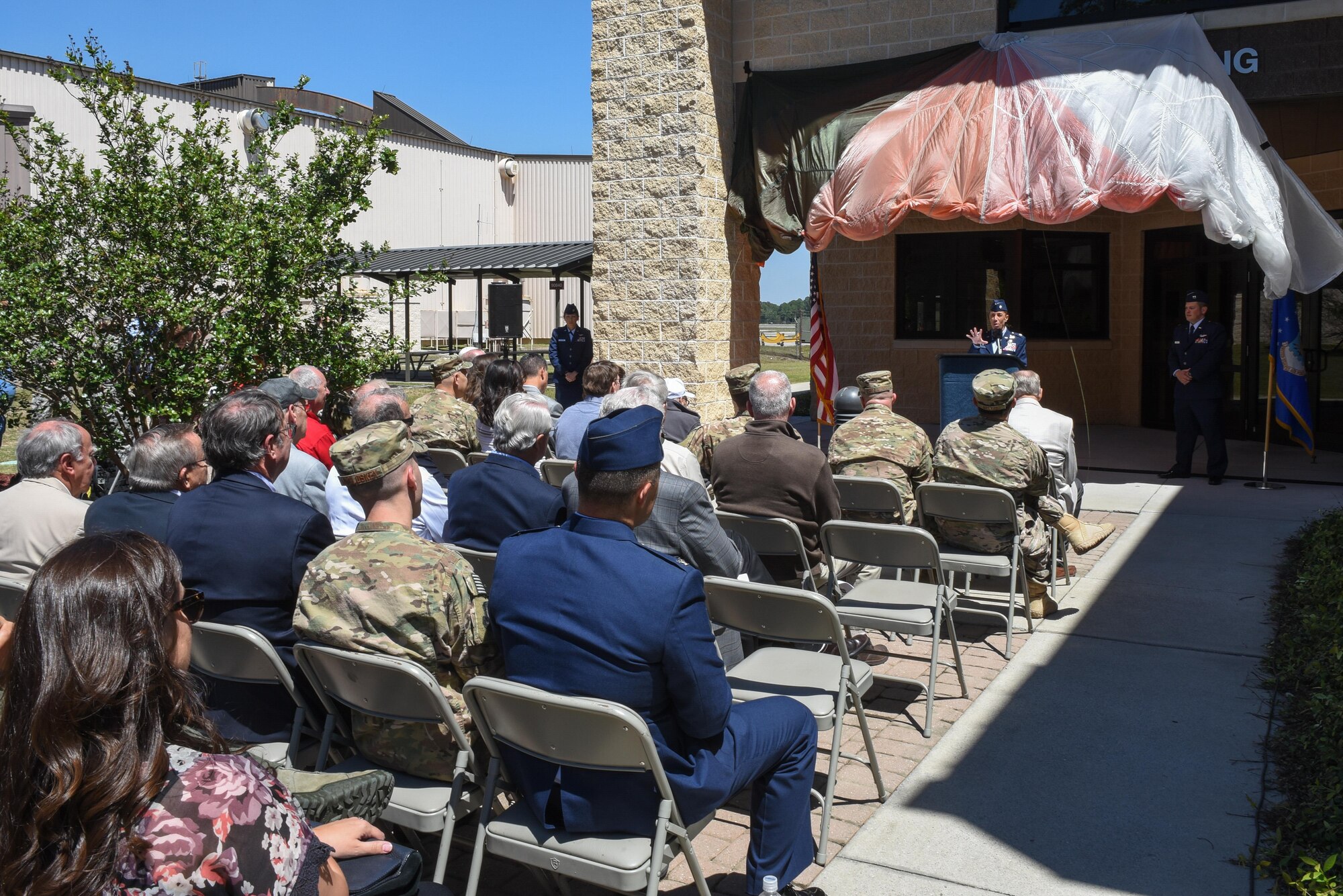 Lt. Col. Allison Black, the commander of the 319th Special Operations Squadron, delivers remarks on retired Lt. Col. Richard E. Cole, the last surviving Doolittle Raider, during the 319th SOS building renaming and dedication ceremony at Hurlburt Field, Fla., April 7, 2017. The building was renamed after Cole, who retired from active duty with a list of accomplishments and awards that includes: the Distinguished Flying Cross with two oak leaf clusters, the Bronze Star medal, the Air Force Commendation medal, the Chinese Army, Navy, Air Corps medal, Class A, 1st Grade. (U.S. Air Force photo by Senior Airman Jeff Parkinson)