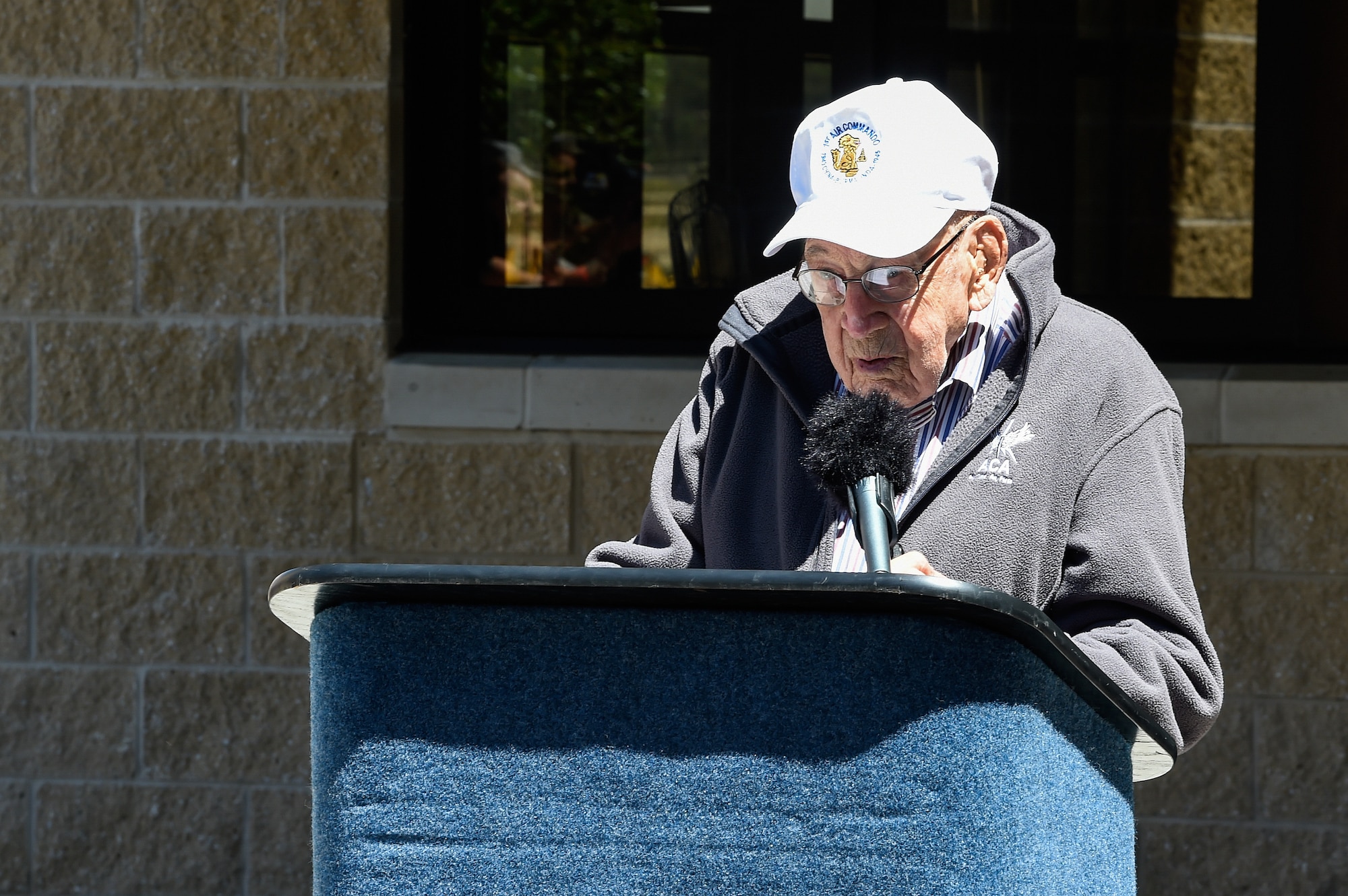 Retired Lt. Col. Richard E. Cole gives remarks after the unveiling of his name on the 319th Special Operations Squadron building during a renaming and dedication ceremony at Hurlburt Field, Fla., April 7, 2017. The 319th SOS building was renamed and dedicated to o Cole, the last surviving Doolittle Raider and co-pilot to then-Lt. Col. James H. Doolittle. (U.S. Air Force photo by Senior Airman Jeff Parkinson)