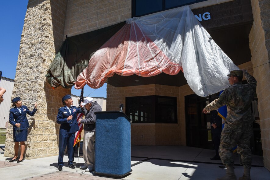 Lt. Col. Allison Black, the commander of the 319th Special Operations Squadron, and retired Lt. Col. Richard E. Cole, pull the canopy to reveal the new name of the 319th SOS building during a renaming and dedication ceremony at Hurlburt Field, Fla., April 7, 2017. In early 1942, Cole volunteered for Special Mission Number 1, which trained at Eglin Air Field, and on April 18, 1942, he served as then-Lt. Col. James H. Doolittle’s co-pilot during the Raid on Tokyo. (U.S. Air Force photo by Senior Airman Jeff Parkinson)