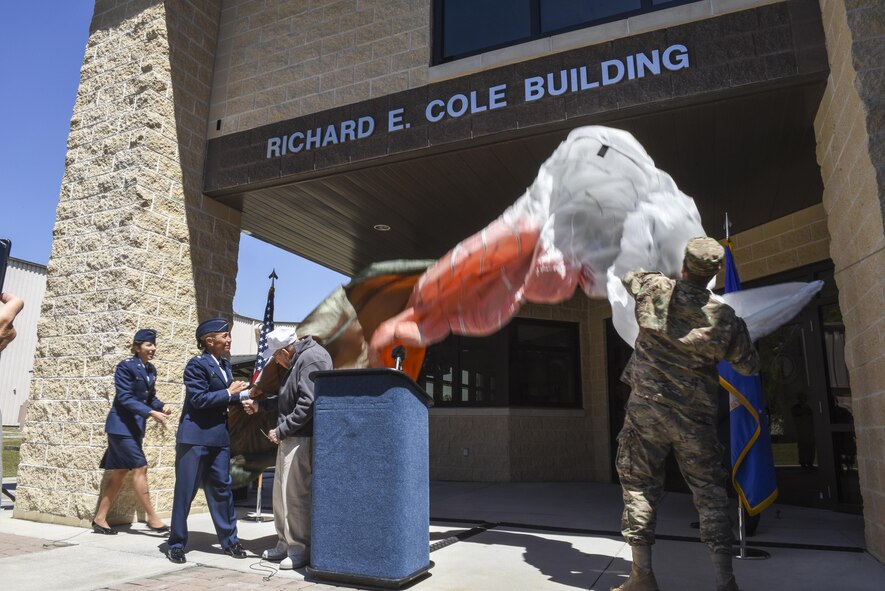 Lt. Col. Allison Black, the commander of the 319th Special Operations Squadron, and retired Lt. Col. Richard E. Cole, pull the canopy to reveal the new name of the 319th SOS building during a renaming and dedication ceremony at Hurlburt Field, Fla., April 7, 2017. In early 1942, Cole volunteered for Special Mission Number 1, which trained at Eglin Air Field, and on April 18, 1942, he served as then-Lt. Col. James H. Doolittle’s co-pilot during the Raid on Tokyo. (U.S. Air Force photo by Senior Airman Jeff Parkinson)