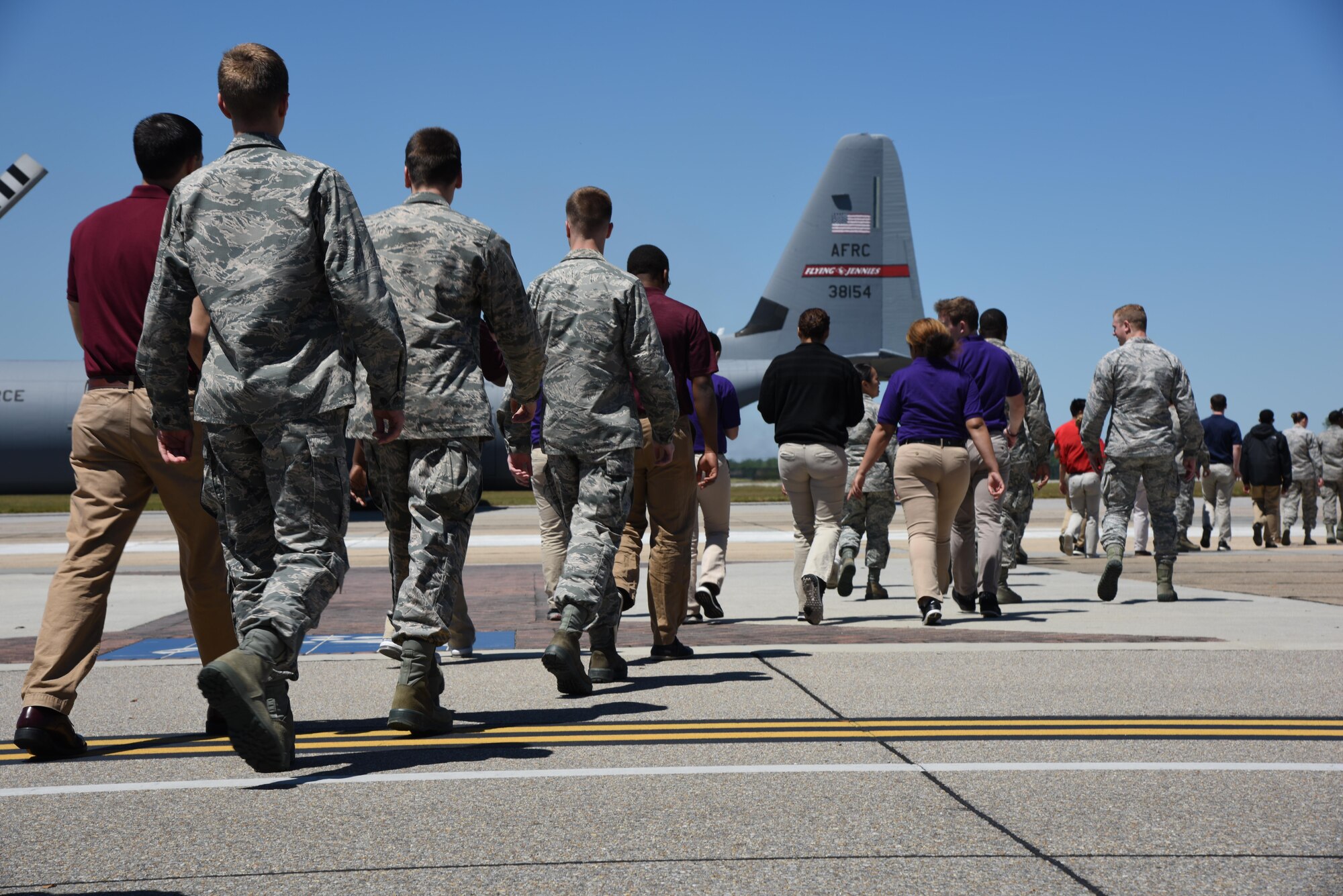 Air Force ROTC cadets walk toward a C-130J Hercules for an incentive flight during Pathways to Blue April 7, 2017, on Keesler Air Force Base, Miss. Pathways to Blue, a diversity outreach event hosted by 2nd Air Force, provides cadets briefings on technical and flying operations and an orientation flight in support of the Air Force's Diversity Strategic Roadmap program. (U.S. Air Force photo by Kemberly Groue)