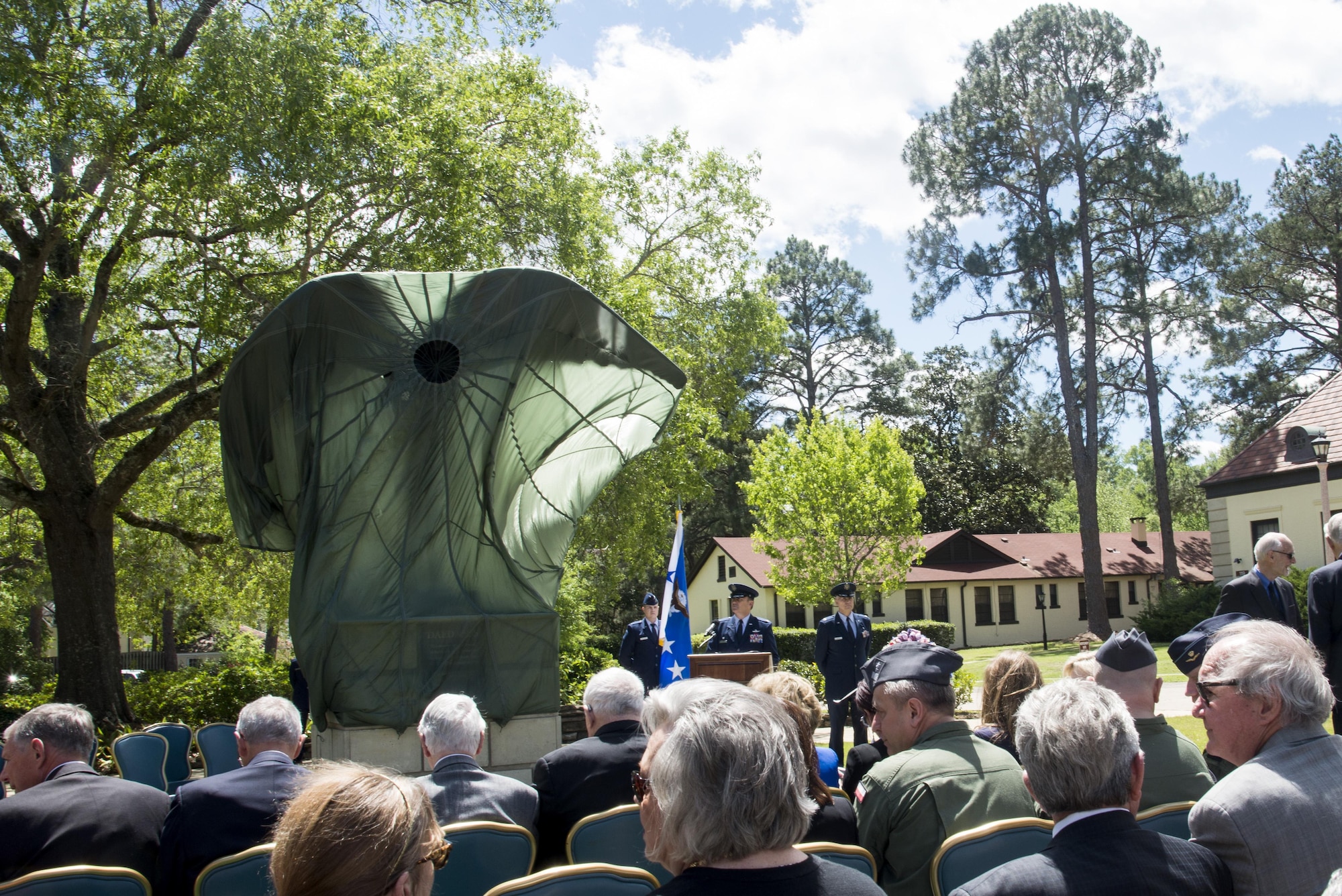 Attendees await for the official unveiling of the Daedalus statue outside of the Maxwell Club, Thursday, April 6, 2017, Maxwell Air Force Base, Ala. The statue was commissioned and donated by Montgomery business owner, Nimrod Frazer, who is a Korean War veteran and Silver Star recipient. (U.S. Air Force photo/ Senior Airman Alexa Culbert)