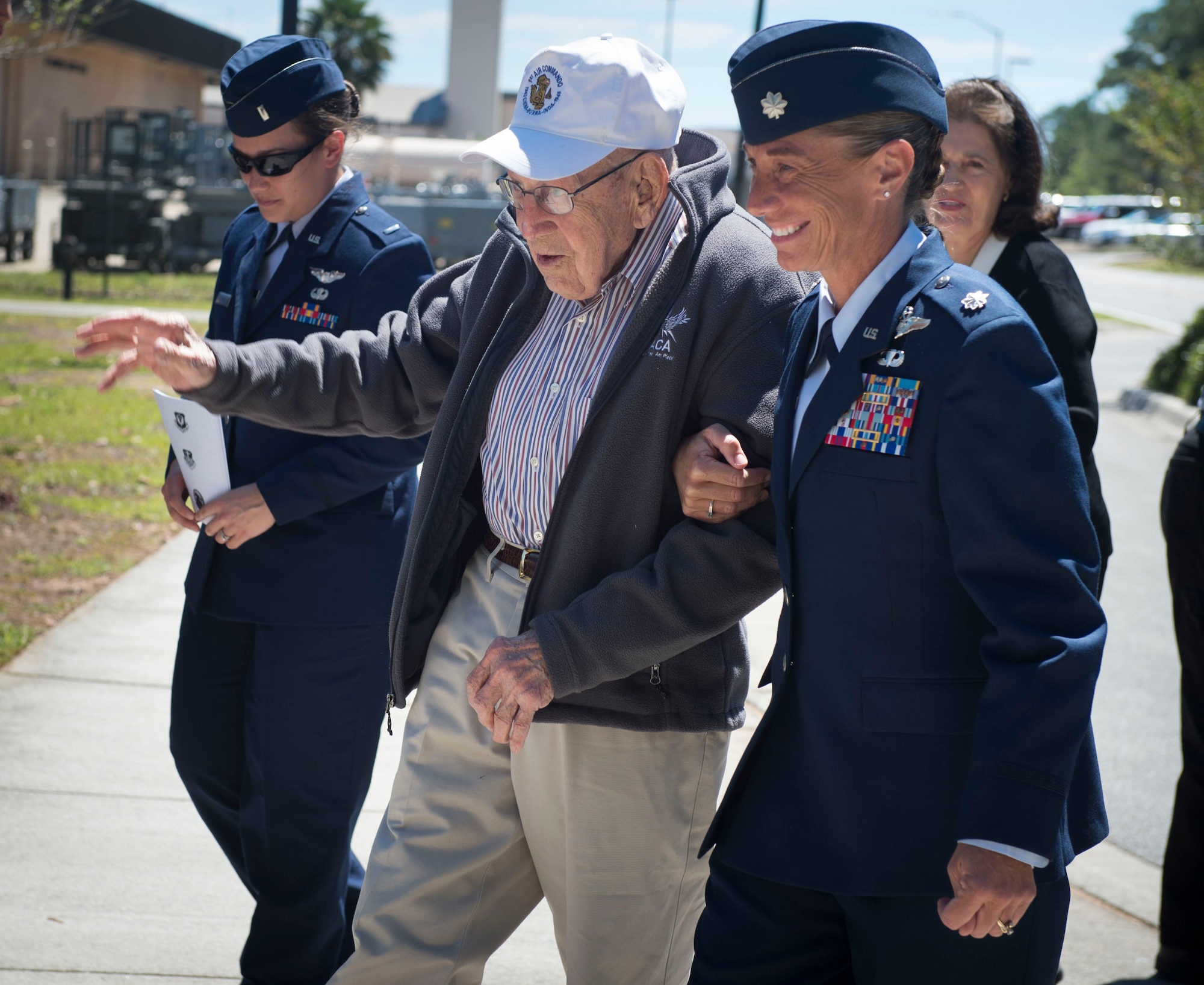 Lt. Col. Allison Black, the commander of the 319th Special Operation Squadron, escorts retired Lt. Col. Richard E. Cole before a building renaming and dedication ceremony at Hurlburt Field, Fla., April 7, 2017. Cole is the last surviving Doolittle Raider whose Air Force roots date back to the origination of the 319th SOS. (U.S. Air Force photo by Senior Airman Krystal M. Garrett)