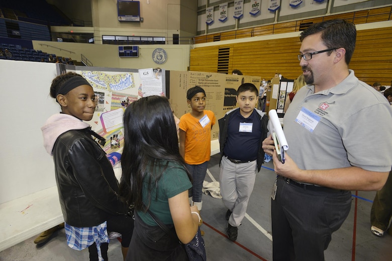 David Bogema, U.S. Army Corps of Engineers Nashville,  civil engineer in the Water Management section talks with students from the Madison Middle School in Goodlettesvill, Tenn., during the Science, Technology, Engineering and Mathematics Expo at Tennessee State University Gentry Center April 6, 2017.   