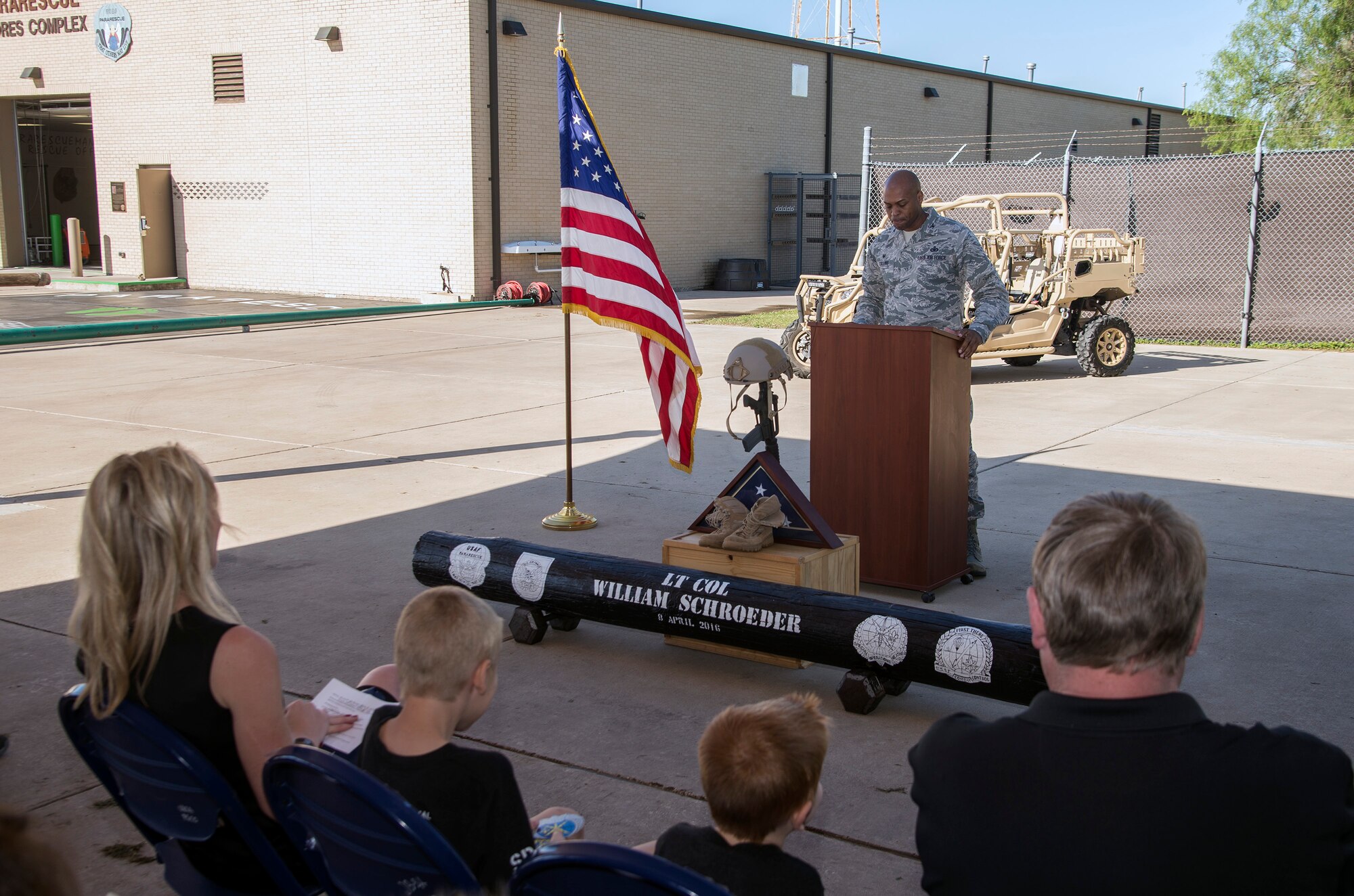 Col. Roy Collins, 37th Training Wing commander, prepares to address the crowd during a memorial remembrance ceremony honoring Lt. Col. William “Bill” Schroeder April 7, 2017, at JBSA-Lackland, Texas, Medina Annex. Schroeder’s unit honored his legacy renaming a drop zone as Schroeder DZ and participated in a "Monster Mash" fitness competition, remembrance ceremony and log march. On April 8, 2016, Schroeder recognized a perilous situation developing and reacted swiftly by putting himself between an armed individual and his first sergeant. In the process, he saved lives of other squadron members while being fatally wounded. Schroeder was posthumously awarded the Airman’s Medal, given to those that distinguish themselves by a heroic act – usually at the volunteer risk of their lives but not involving combat.  (U.S. Air Force photo by Johnny Saldivar)
