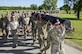 Members of the 350th Battlefield Airmen Training Squadron and from throughout Joint Base San Antonio-Lackland participated in a 1-mile log march during a memorial remembrance ceremony honoring Lt. Col. William “Bill” Schroeder April 7, 2017, at JBSA-Lackland, Texas, Medina Annex. Schroeder’s unit honored his legacy by renaming a drop zone as Schroeder DZ and participated in a "Monster Mash" fitness competition, remembrance ceremony and log march. On April 8, 2016, Schroeder recognized a perilous situation developing and reacted swiftly by putting himself between an armed individual and his first sergeant. In the process, he saved lives of other squadron members while being fatally wounded. Schroeder was posthumously awarded the Airman’s Medal, given to those that distinguish themselves by a heroic act – usually at the volunteer risk of their lives but not involving combat. (U.S. Air Force photo by Johnny Saldivar)

