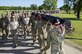 Members of the 350th Battlefield Airmen Training Squadron and from throughout Joint Base San Antonio-Lackland participated in a 1-mile log march during a memorial remembrance ceremony honoring Lt. Col. William “Bill” Schroeder April 7, 2017, at JBSA-Lackland, Texas, Medina Annex. Schroeder’s unit honored his legacy by renaming a drop zone as Schroeder DZ and participated in a "Monster Mash" fitness competition, remembrance ceremony and log march. On April 8, 2016, Schroeder recognized a perilous situation developing and reacted swiftly by putting himself between an armed individual and his first sergeant. In the process, he saved lives of other squadron members while being fatally wounded. Schroeder was posthumously awarded the Airman’s Medal, given to those that distinguish themselves by a heroic act – usually at the volunteer risk of their lives but not involving combat. (U.S. Air Force photo by Johnny Saldivar)

