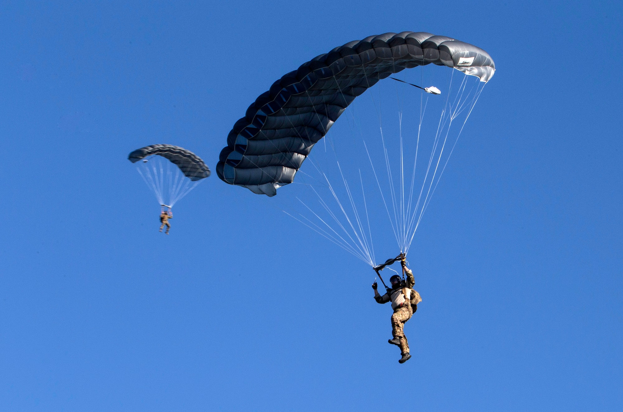 Members of the 350th Battlefield Airmen Training Squadron prepare to land on the newly renamed Schroeder drop zone during a memorial remembrance ceremony honoring Lt. Col. William “Bill” Schroeder April 7, 2017, at JBSA-Lackland, Texas, Medina Annex. Schroeder’s unit honored his legacy renaming a drop zone as Schroeder DZ and participated in a "Monster Mash" fitness competition, remembrance ceremony and log march. On April 8, 2016 Schroeder recognized a perilous situation developing and reacted swiftly by putting himself between an armed individual and his first sergeant. In the process, he saved lives of other squadron members while being fatally wounded. Schroeder was posthumously awarded the Airman’s Medal, given to those that distinguish themselves by a heroic act – usually at the volunteer risk of their lives but not involving combat.  (U.S. Air Force photo by Johnny Saldivar)