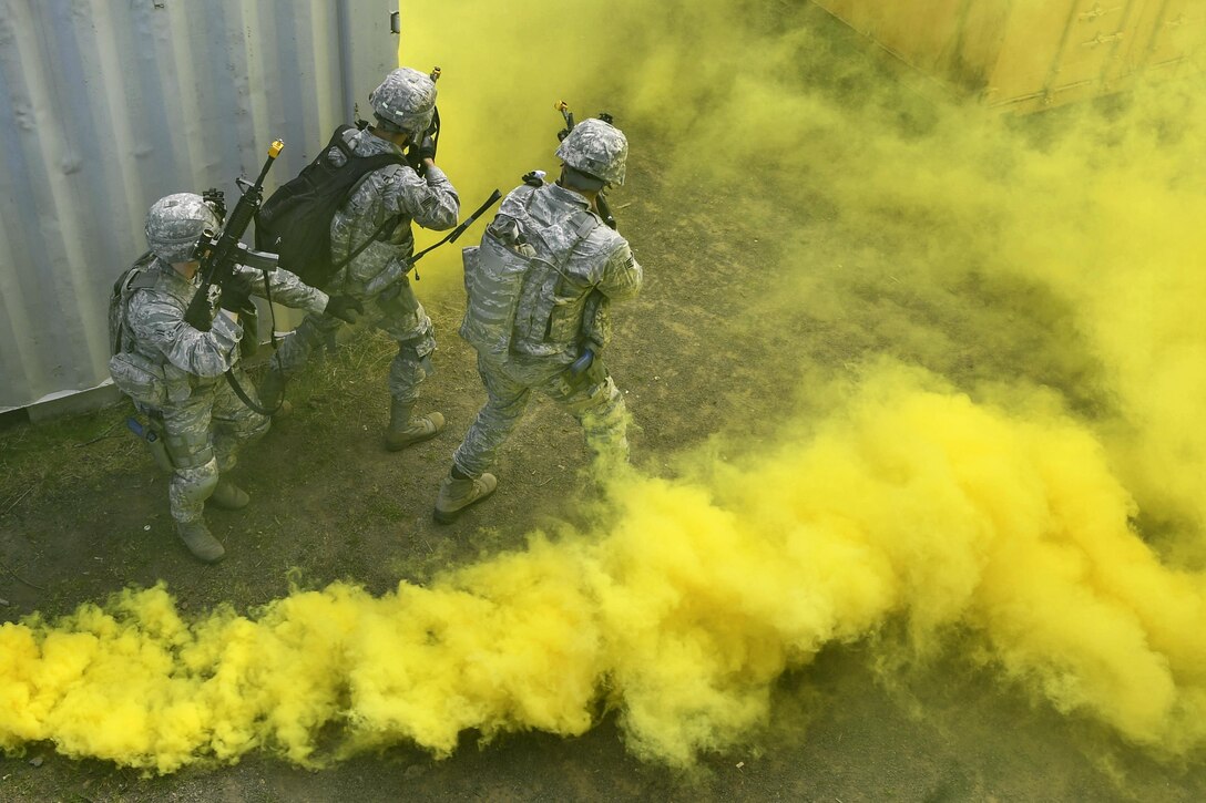 Airmen tactically move through a simulated village during an urban operations training course at U.S. Army Garrison Baumholder, Germany, April 4, 2017. The course provided predeployment training to airmen who will be going downrange. Air Force photo by Senior Airman Tryphena Mayhugh