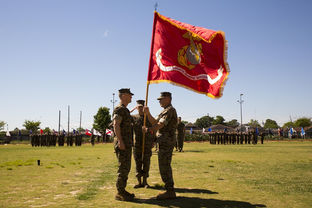 Maj. Gen. Burke W. Whitman (left), the incoming commanding general of 4th Marine Division, accepts the Marine Corps Colors from Brig. Gen. Paul K. Lebidine (right), the outgoing commanding general of 4th Marine Division, during a change of command ceremony at Marine Corps Support Facility New Orleans, April 7, 2017. Whitman assumes leadership of the largest division command in the Marine Corps. (U.S. Marine Corps photo by Pfc. Niles Lee/Released)