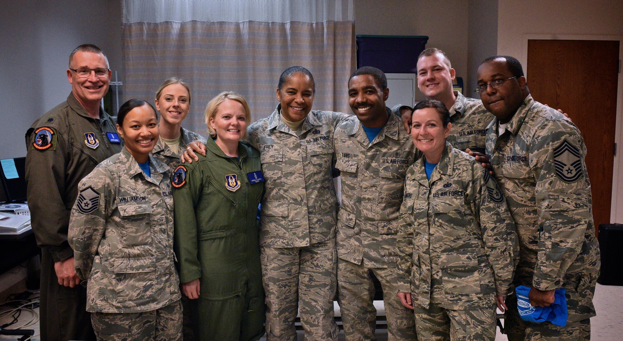 Chief Master Sgt. Shelina Frey, center, Air Mobility Command command chief, shares a photo moment April 1st, 2017 with Team Scott members from from the 932nd Medical Squadron, Scott Air Force Base, Illinois. Frey spent the day visiting the 932nd AW learning about the different squadrons that make up the Air Force Reserve Command unit located at Scott AFB.  (U.S. Air Force photo by Tech. Sgt. Christopher Parr)
