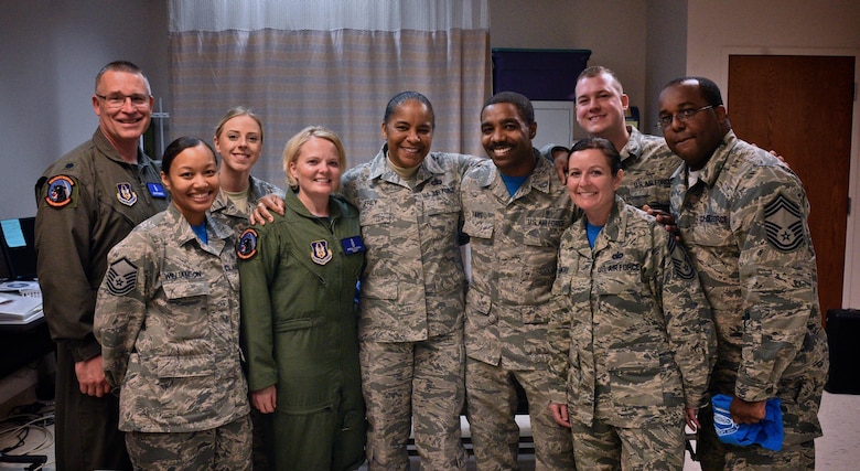 Chief Master Sgt. Shelina Frey, center, Air Mobility Command command chief, shares a photo moment April 1st, 2017 with Team Scott members from from the 932nd Medical Squadron, Scott Air Force Base, Illinois. Frey spent the day visiting the 932nd AW learning about the different squadrons that make up the Air Force Reserve Command unit located at Scott AFB.  (U.S. Air Force photo by Tech. Sgt. Christopher Parr)