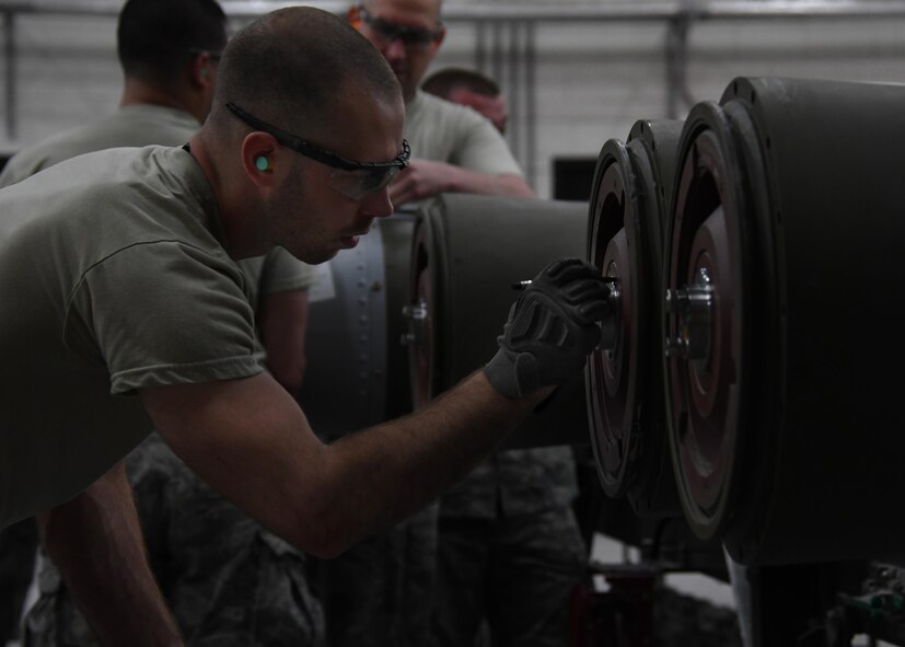 U.S. Air Force Airman 1st Class Joshua Despain, an ammo Airman with the 379th Expeditionary Maintenance Squadron, torques down fuse rings on a guided bomb unit-31 at Al Udeid Air Base, Qatar, April 6, 2017. The ammo shop at Al Udeid is responsible for assembling and transporting bombs and munitions, which help support combat operations in the U.S. Central Command area of responsibility. (U.S. Air Force photo by Staff Sergeant Miles Wilson)