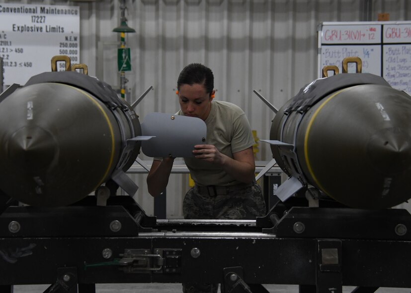 U.S. Air Force Staff Sgt. Amanda Clare, an ammo Airman assigned to the 379th Expeditionary Maintenance Squadron, connects a fin kit to a fuse on a guided bomb unit-31 at Al Udeid Air Base, Qatar, April 6, 2017. The ammo Airmen at Al Udeid work around the clock to provide bombs and munitions used to support combat operations across the U.S. Central Command area of responsibility. (U.S. Air Force photo by Staff Sergeant Miles Wilson)
