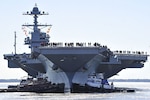 Sailors aboard the aircraft carrier Pre-Commissioning Unit (PCU) Gerald R. Ford (CVN 78) man the rails as the ship departs Huntington Ingalls Industries Newport News Shipbuilding for builder's sea trials off the U.S. East Coast. The first-of-class ship-the first new U.S. aircraft carrier design in 40 years-will spend several days conducting builder's sea trials, a comprehensive test of many of the ship's key systems and technologies. 