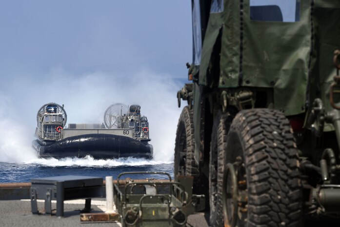 Landing Craft Air Cushion 60, assigned to Assault Craft Unit 4 (ACU 4), approaches the well deck aboard the amphibious dock landing ship USS Carter Hall (LSD 50) in the U.S. 5th Fleet area of operations during exercise Alligator Dagger 2017. Alligator Dagger 17 provides an opportunity to enhance multilateral capabilities in critical mission sets inherent to the U.S. Navy-Marine Corps, as well as partners and allies in the region. (U.S. Navy photo by Mass Communication Specialist 1st Class Darren M. Moore)