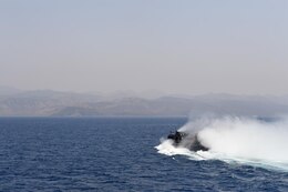Landing Craft Air Cushion 2, assigned to Assault Craft Unit 4 (ACU 4), departs the well deck aboard the amphibious dock landing ship USS Carter Hall (LSD 50) in the U.S. 5th Fleet area of operations to take vehicle and equipment to the beach for exercise Alligator Dagger 2017. Alligator Dagger 17 provides an opportunity to enhance multilateral capabilities in critical mission sets inherent to the U.S. Navy-Marine Corps, as well as partners and allies in the region. (U.S. Navy photo by Mass Communication Specialist 1st Class Darren M. Moore)
