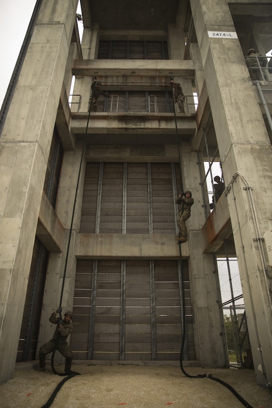 Marines with Fox Company, Battalion Landing Team, 2nd Battalion, 5th Marines fast rope during training at Camp Hansen, Okinawa, Japan, Feb. 23, 2017. BLT 2/5, from Marine Corps Base Camp Pendleton, California, is the Ground Combat Element for the 31st Marine Expeditionary Unit. The instructors explained the different environments in which the rope would hang sideways due to the turbulence of the aircraft. As the Marine Corps’ only continuously forward deployed unit, the 31st MEU’s air-ground-logistics team provides a flexible force, ready to perform a wide range of military operations, from limited combat to humanitarian assistance operations, throughout the Indo-Asia- Pacific region. (U.S. Marine Corps photo by Lance Cpl. Breanna L. Weisenberger/Released) 