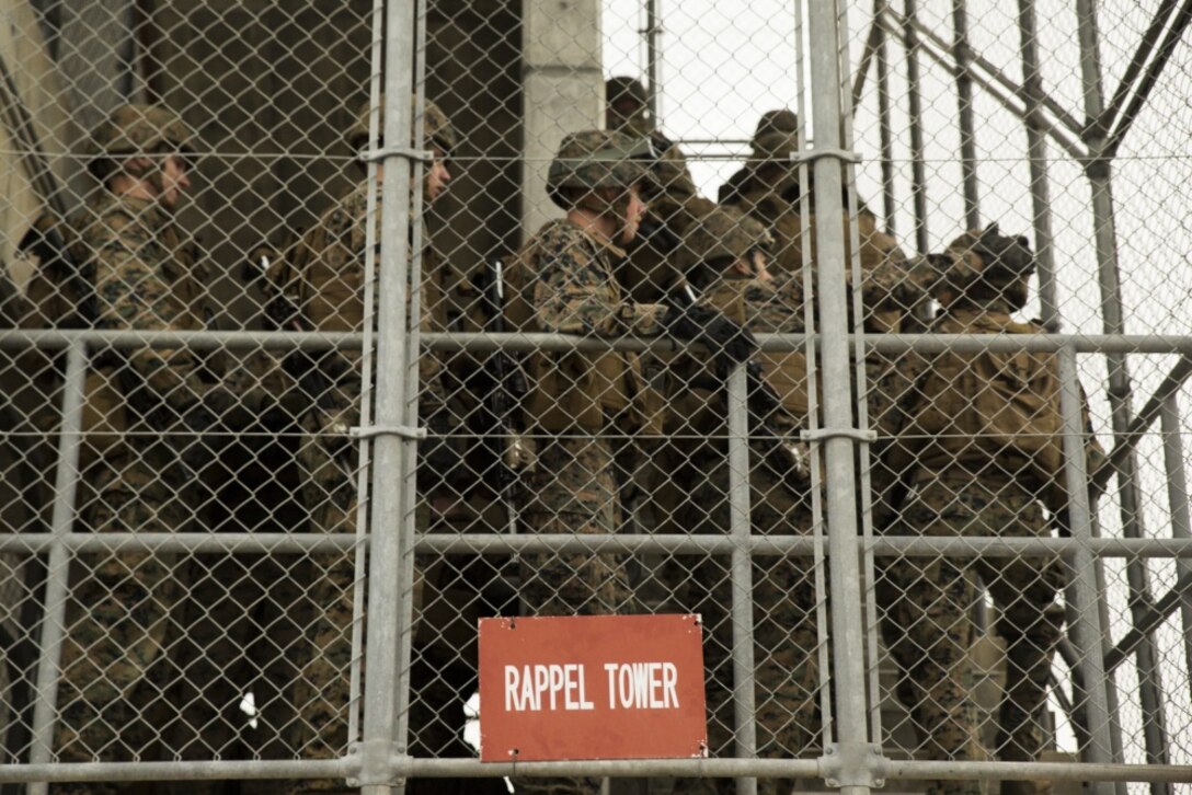 Marines with Fox Company, Battalion Landing Team, 2nd Battalion, 5th Marines climb the stairs of the rappel tower during fast rope training at Camp Hansen, Okinawa, Japan, Feb. 23, 2017. Each Marine descends multiple times, each time adding more gear increasing the technical and tactical challenge of the training. BLT 2/5, from Marine Corps Base Camp Pendleton, California, is the Ground Combat Element for the 31st Marine Expeditionary Unit. As the Marine Corps’ only continuously forward deployed unit, the 31st MEU's air-ground-logistics team provides a flexible force, ready to perform a wide range of military operations, from limited combat to humanitarian assistance operations, throughout the Indo-Asia- Pacific region. (U.S. Marine Corps photo by Lance Cpl. Breanna L. Weisenberger/Released) 