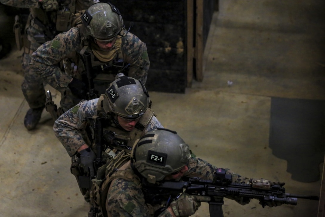 Force reconnaissance Marines with Maritime Raid Force, 31st Marine Expeditionary Unit, maneuver through a hallway during a close corners training event at Camp Hansen, Okinawa, Japan Feb. 27, 2017. MRF specializes in amphibious reconnaissance, vessel Visit, Board, Search, and Seizure operations and limited combat operations as the reconnaissance element of the 31st MEU. As the Marine Corps' only continuously forward-deployed unit, the 31st Marine Expeditionary Unit's air-ground-logistics team range of military operations, from limited combat to humanitarian assistance operations, throughout the Indo-Asia-Pacific region. (U.S. Marine Corps photo by Cpl. Jona R. Meme/Released) 