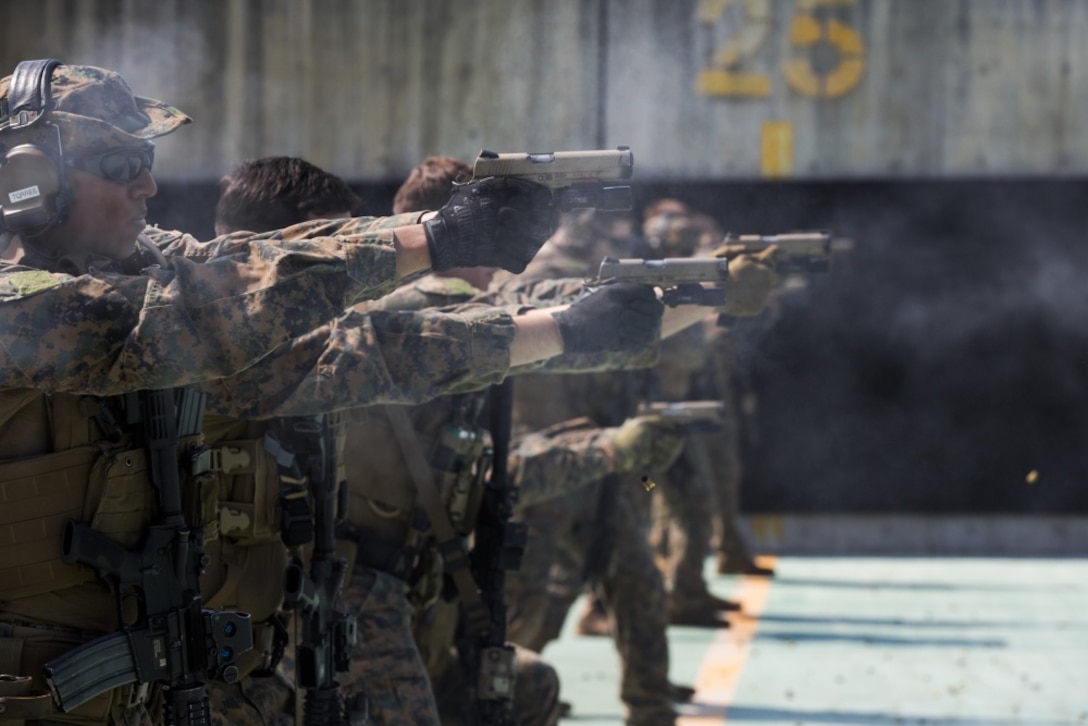 Force reconnaissance Marines with Maritime Raid Force, 31st Marine Expeditionary Unit, fire M45A1 pistols during a range at Camp Hansen, Okinawa, Japan, Feb. 27, 2017. MRF specializes in amphibious reconnaissance, vessel Visit, Board, Search, and Seizure operations and limited combat operations as the reconnaissance element of the 31st MEU. As the Marine Corps' only continuously forward-deployed unit, the 31st Marine Expeditionary Unit's air-ground-logistics team range of military operations, from limited combat to humanitarian assistance operations, throughout the Indo-Asia-Pacific region. (U.S. Marine Corps photo by Cpl. Jona R. Meme/Released)