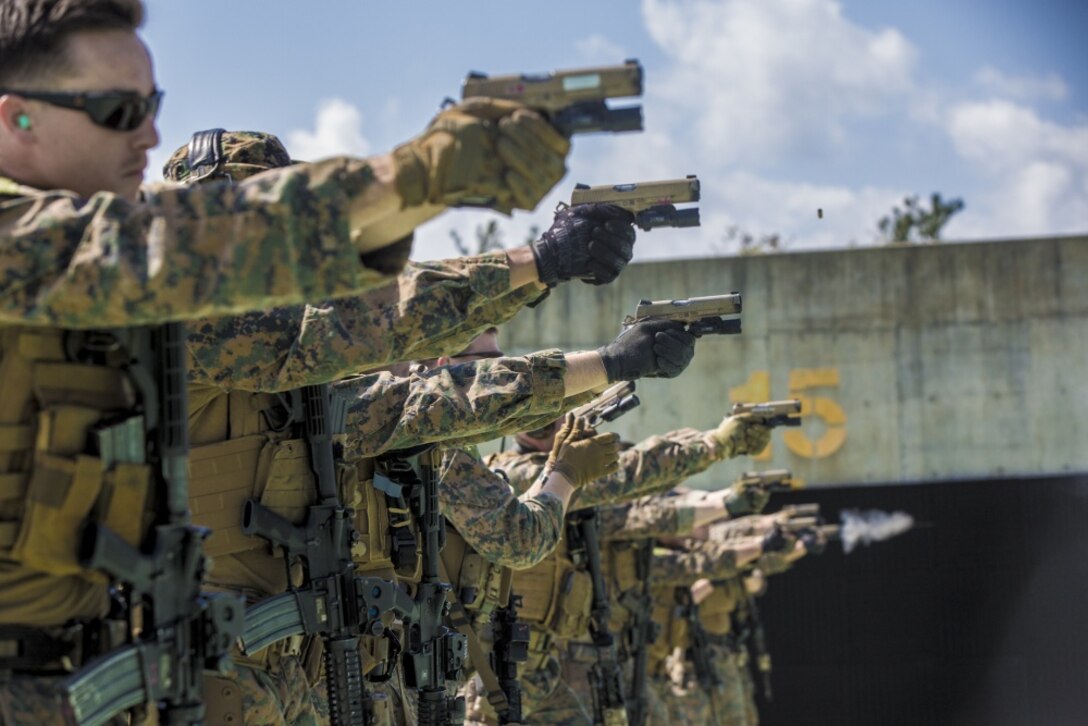 Force reconnaissance Marines with Maritime Raid Force, 31st Marine Expeditionary Unit, fire M45A1 pistols during a range at Camp Hansen, Okinawa, Japan Feb. 27, 2017. MRF specializes in amphibious reconnaissance, vessel Visit, Board, Search, and Seizure operations and limited combat operations as the reconnaissance element of the 31st MEU. As the Marine Corps' only continuously forward-deployed unit, the 31st Marine Expeditionary Unit's air-ground-logistics team range of military operations, from limited combat to humanitarian assistance operations, throughout the Indo-Asia-Pacific region. (U.S. Marine Corps photo by Cpl. Jona R. Meme/Released) 