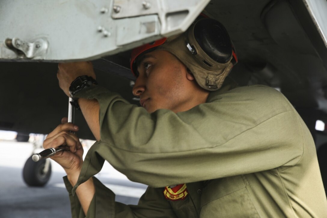 Lance Cpl. Roberto Almanza, an aviation ordinance technician with Marine Medium Tiltrotor Squadron 262 (Reinforced), 31st Marine Expeditionary Unit, conducts maintenance on an AV-8B Harrier weapon system on the flight deck of the USS Bonhomme Richard (LHD 6) March 8, 2017 at White Beach Naval Base, Okinawa, Japan. Marines and Sailors of the 31st MEU embarked aboard the USS Bonhomme Richard (LHD 6), part of the Bonhomme Richard Amphibious Readiness Group, as part of their annual spring patrol of the Indo-Asia-Pacific region. The 31st MEU, embarked on the amphibious ships of the Expeditionary Strike Group 7, has the capability to respond to any crisis or contingency at a moment’s notice. (U.S. Marine Corps photo by Sgt. Tiffany Edwards) 