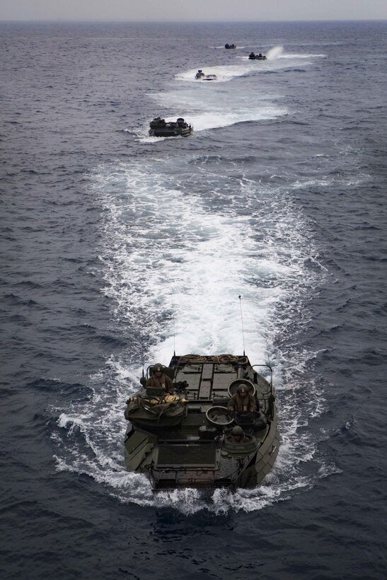 Marine Corps AAV-P7/A1 assault amphibious vehicles with Battalion Landing Team, 2nd Battalion, 5th Marines, 31st Marine Expeditionary Unit, maneuver off the coast of Okinawa, Japan, March 8, 2017. AAVs maneuvered into the well deck of USS Ashland (LSD 48) as part of the 31st MEU's regularly scheduled spring patrol aboard ships of the Bonhomme Richard Amphibious Ready Group. As the Marine Corps' only continuously forward-deployed unit, the 31st MEU air-ground-logistics team provides a flexible force, ready to perform a wide range of military operations, from limited combat to humanitarian assistance operations, throughout the Indo-Asia Pacific region. (U.S. Marine Corps photo by Cpl. Darien J. Bjorndal) 