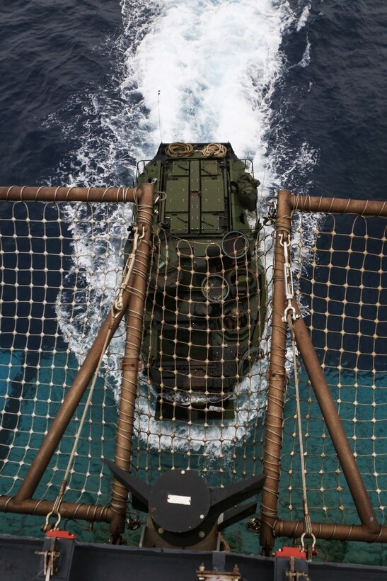 A Marine Corps AAV-P7/A1 assault amphibious vehicle with Battalion Landing Team, 2nd Battalion, 5th Marines, 31st Marine Expeditionary Unit, maneuvers into the well deck of USS Ashland (LSD 48) off the coast of Okinawa, Japan, March 8, 2017. BLT 2/5 is currently aboard ships of the Bonhomme Richard Amphibious Ready Group as part of the 31st Marine Expeditionary Unit's regularly scheduled spring patrol. As the Marine Corps' only continuously forward-deployed unit, the 31st MEU air-ground-logistics team provides a flexible force, ready to perform a wide range of military operations, from limited combat to humanitarian assistance operations, throughout the Indo-Asia Pacific region. (U.S. Marine Corps photo by Cpl. Darien J. Bjorndal)
