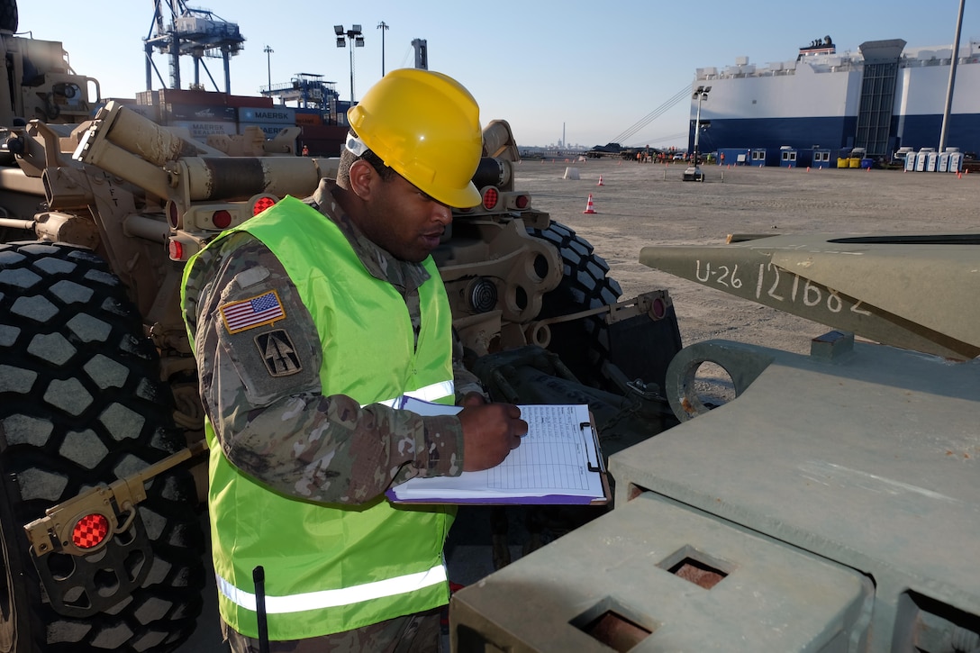 The 7th Mission Support Command’s Spc. William Battle, a movement specialist with the 793rd Movement Control Team, conducts port disembarkation operations for military vehicles, equipment download and convoy staging with from the 497th Combat Sustainment Support Battalion, the 39th Transportation Battalion (MC), 16th Sustainment Brigade, 21st Theater Sustainment Command, 1st Inland Cargo Company, 18th Combat Sustainment Support Battalion, 405th Army Field Support Brigade, 32nd Composite Truck Company and the 839th Transportation Battalion from the Surface Deployment and Distribution Command as part of Operation Atlantic Resolve March 31, 2017.  