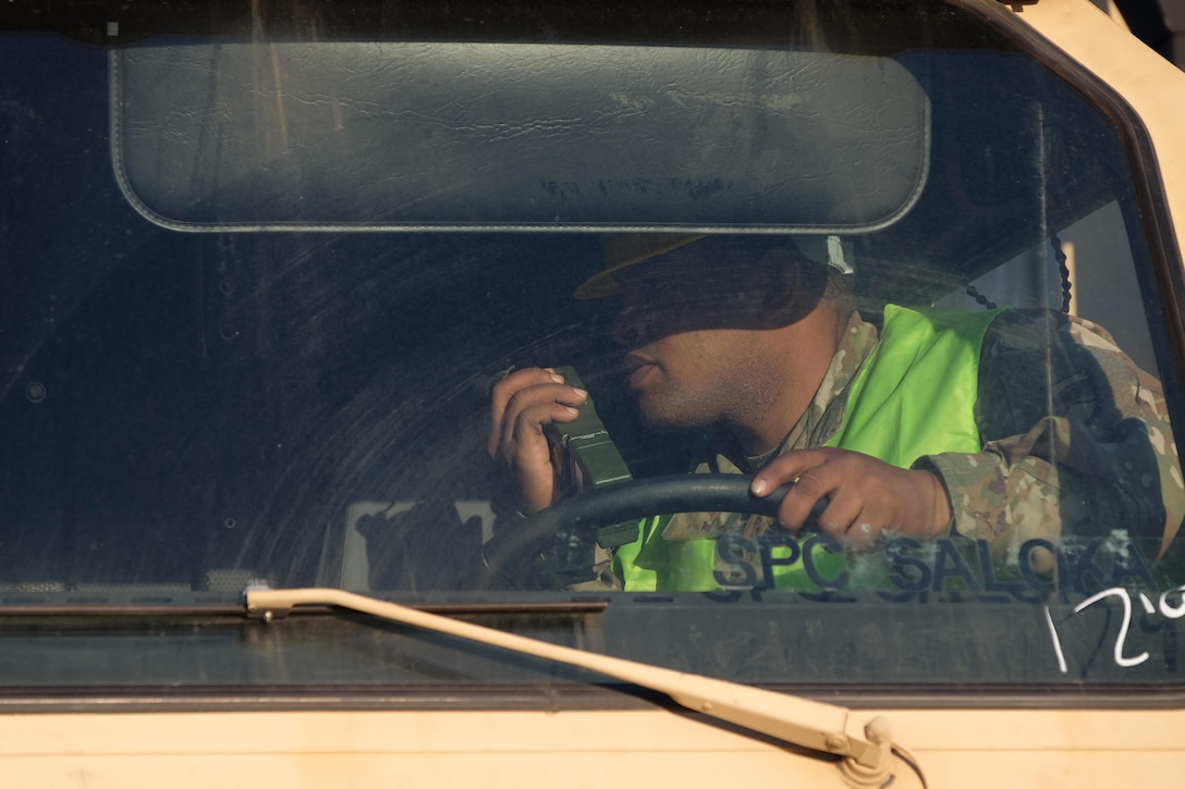 The 7th Mission Support Command’s Spc. William Battle, a movement specialist with the 793rd Movement Control Team, conducts port disembarkation operations for military vehicles, equipment download and convoy staging with Soldiers from the 497th Combat Sustainment Support Battalion, the 39th Transportation Battalion (MC), 16th Sustainment Brigade, 21st Theater Sustainment Command, 1st Inland Cargo Company, 18th Combat Sustainment Support Battalion, 405th Army Field Support Brigade, 32nd Composite Truck Company and the 839th Transportation Battalion from the Surface Deployment and Distribution Command as part of Operation Atlantic Resolve March 31, 2017