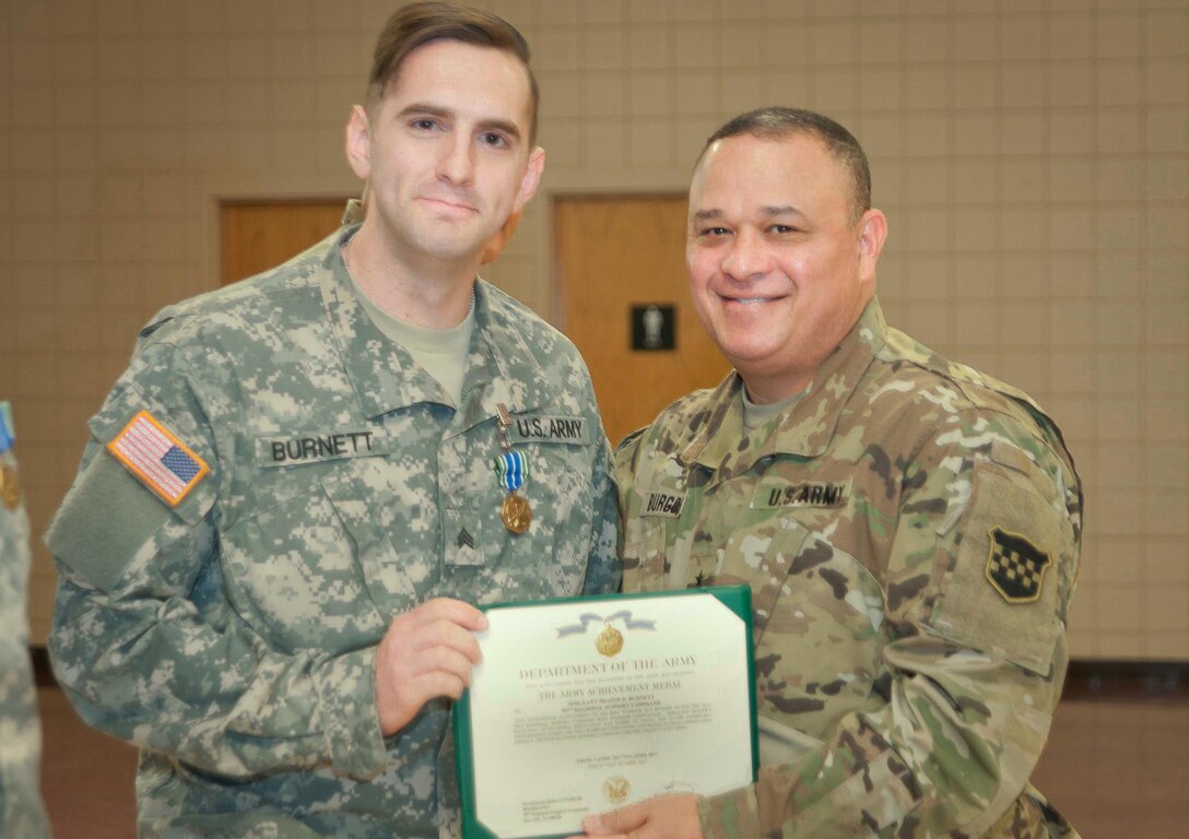 Brig. Gen. Jose Burgos, Deputy Commanding General, 99th Regional Support Command (right) poses for a photo with Sgt. Shafer Burnett, after receiving an Army Achievement Medal during a ceremony at Fort Devens Massachusetts, 6 April, 2017. Burnett received the award for finishing as runner-up in the Noncommissioned Officer category of the 99th Regional Support Command's 2017 Best Warrior Competition that took place here 2-6 April.