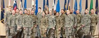 Soldier-competitors from the 99th Regional Support Command pose with their sponsors and Deputy Commanding General and Command Sgt. Maj. of the 99th RSC after the conclusion of the command’s 2017 Best Warrior Competition ceremony at Fort Devens, Massachusetts on 6 April 2017. The 11 competitors, with the assistance of their sponsors, vied to see if they had what it takes to win in the Junior Enlisted or Noncommissioned Officer category and move on to the U.S. Army Reserve Command’s 2017 Best Warrior Competition slated for June.