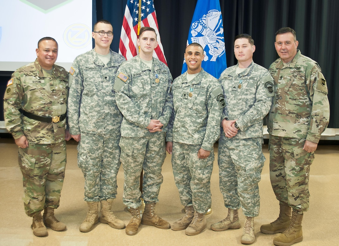 Soldier-competitors from the 99th Regional Support Command pose with Brig. Gen. Jose Burgos, Deputy Commanding General and Command Sgt. Maj. Arlindo Almeida, Command Sergeant Major of the 99th Regional Support Command pose for a picture with the winners and runners up from the command’s 2017 Best Warrior Competition at Fort Devens, Massachusetts on 6 April 2017. Of the 11 competitors from the command, these Soldiers stood out amongst their peers in the Junior Enlisted and Noncommissioned Officer categories the winners will move on to the U.S. Army Reserve Command’s 2017 Best Warrior Competition slated for June.