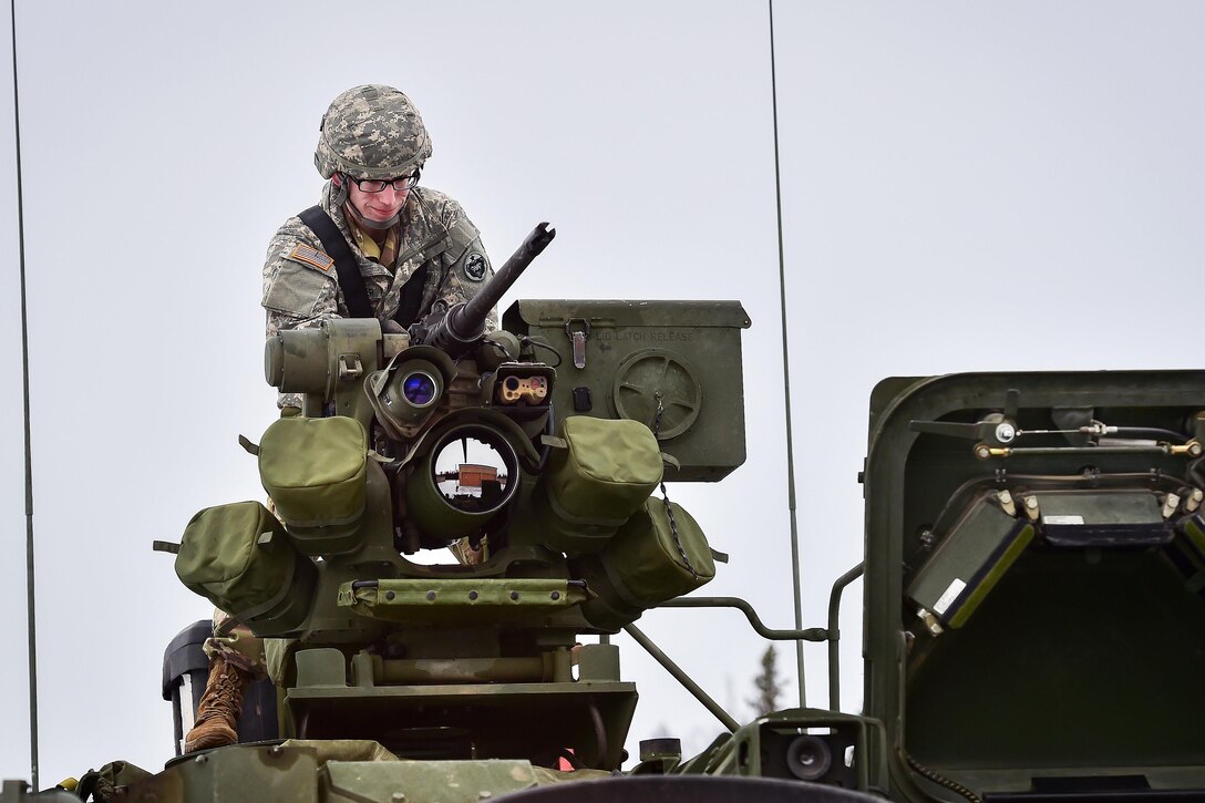 Army Spc. David Harper prepares a Protector M151 Remote Weapon Station with a .50-cal M2 machine gun aboard an M1135 Stryker nuclear biological chemical reconnaissance vehicle for operation during a live-fire gunnery exercise at Joint Base Elmendorf-Richardson, Alaska, April 5, 2017. Harper is assigned to the 95th Chemical Company. The range tested the proficiency of soldiers to identify, engage, and eliminate hostile targets while increasing combat effectiveness. Air Force photo by Justin Connaher