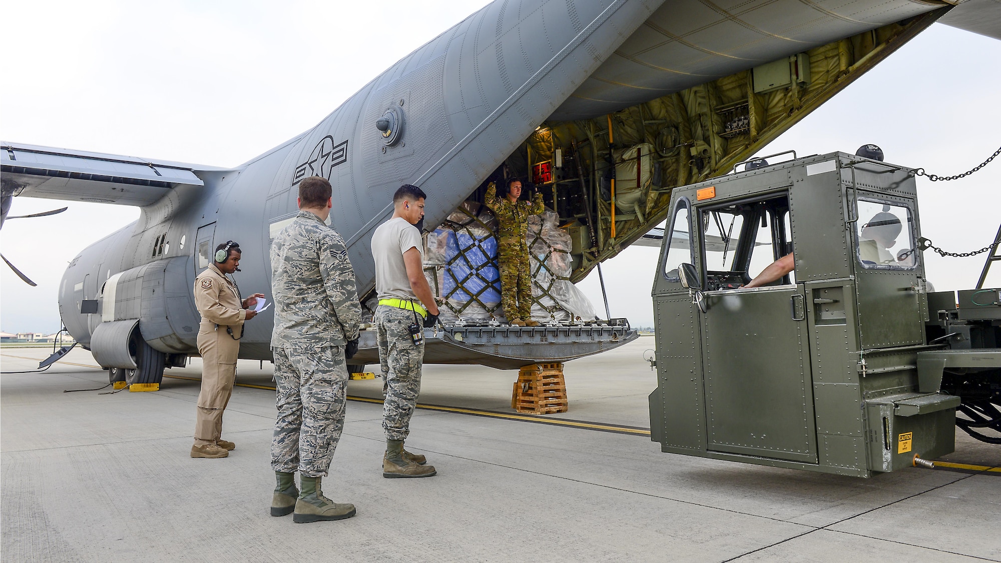 Airmen from the 724th Air Mobility Squadron unload cargo from a C-130 Hercules at Aviano Air Base, Italy, April 6, 2017.  The 724th AMS is responsible for facilitating the transportation of approximately 6,500 tons of cargo each year into and out of Aviano AB.  (U.S. Air Force photo by Airman 1st Class Ryan Brooks)