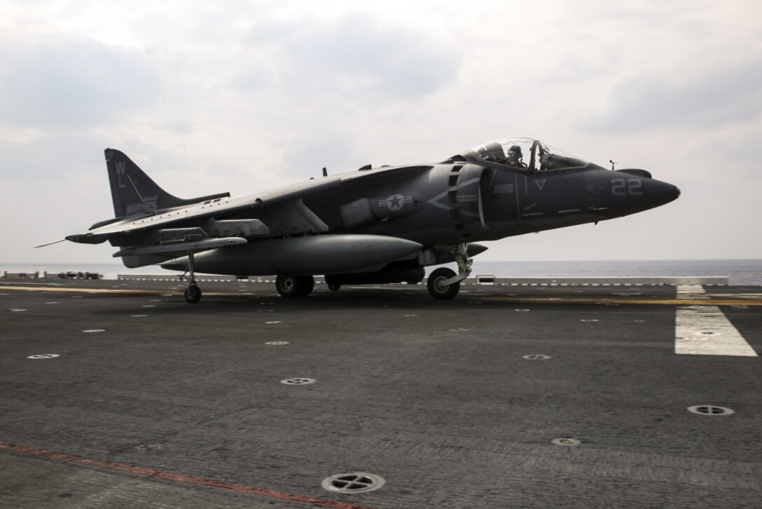 An AV-8B Harrier pilot with Marine Attack Squadron 311, 31st Marine Expeditionary Unit, signals to flight deck personnel during flight operations aboard the USS Bonhomme Richard March 9, 2017. Marines and sailors of the 31st MEU embarked aboard the USS Bonhomme Richard, part of the Bonhomme Richard Amphibious Readiness Group, as part of their annual spring patrol of the Indo-Asia-Pacific region. The 31st MEU, embarked on the amphibious ships of the Expeditionary Strike Group 7, has the capability to respond to any crisis or contingency at a moment’s notice. 