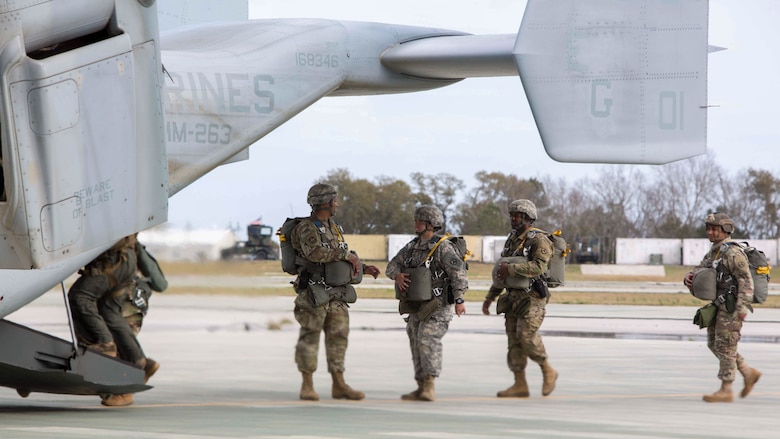 Soldiers board an MV-22B Osprey during an air-drop delivery jump exercise with the Marine Corps at Marine Corps Auxiliary Landing Field Bogue, N.C., March 27, 2017. The Soldiers participated in field exercise Bold Bronco 17, allowing Marines and Soldiers to get exposure working together on transportation operations. The Soldiers are with 647th Quartermaster Company, 3rd Expeditionary Sustainment Command. 