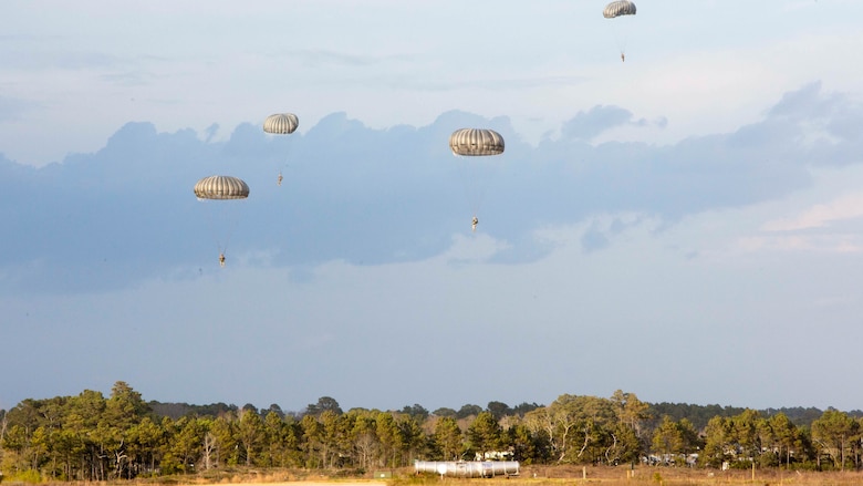 Soldiers jump from an MV-22B Osprey for the first time during an air-drop delivery jump exercise with the Marine Corps at Marine Corps Auxiliary Landing Field Bogue, N.C., March 28, 2017. The Soldiers participated in field exercise Bold Bronco 17, allowing Marines and Soldiers to get exposure working together on transportation operations. The Soldiers are with 647th Quartermaster Company, 3rd Expeditionary Sustainment Command. 