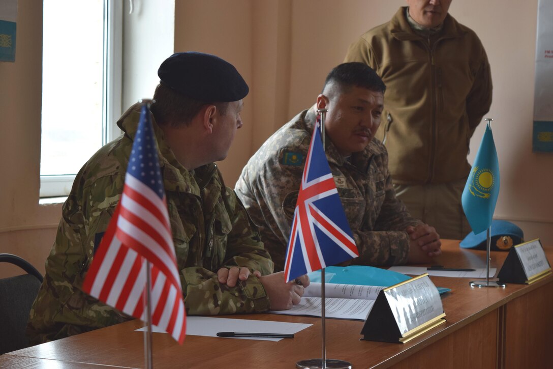 Gen. Maj. Almaz Jumakeyev, chief of Air Assault Forces for Kazakhstan, right, welcomes Brig. Gen. Alan Richmond of the British Army's 160th Infantry Brigade, along with U.S. and U.K. defense officials, Apr. 6, 2017, during a progress update for Steppe Eagle Koktem at Illisky Training Center, Kazakhstan.