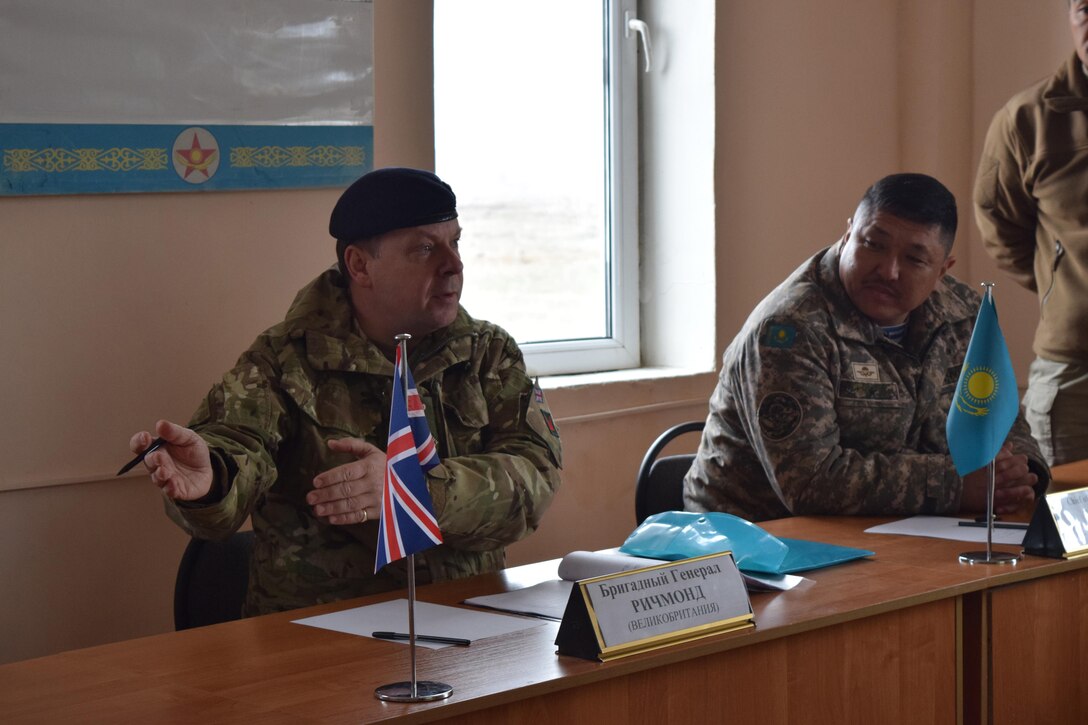 Brig. Gen. Alan Richmond, commander of the British Army's 160th Infantry Brigade, left, introduces defense officials from the U.K. after a progress briefing for Steppe Eagle Koktem Apr. 6, 2017, at Illisky Training Center, Kazakhstan.